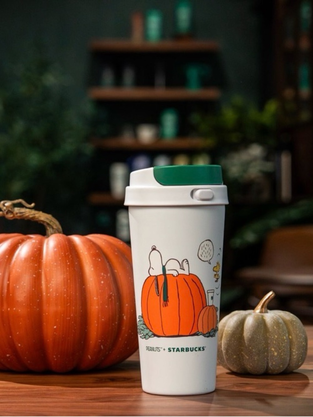 Starbucks White Travel Tumbler with Green Lid and Pumpkin Peanuts Art